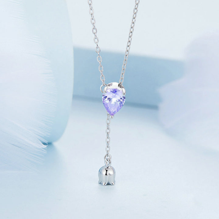 Collier de lys de lariat vertical