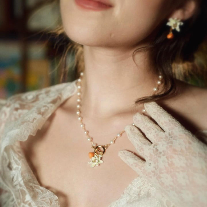 orange pearl necklace and earrings
