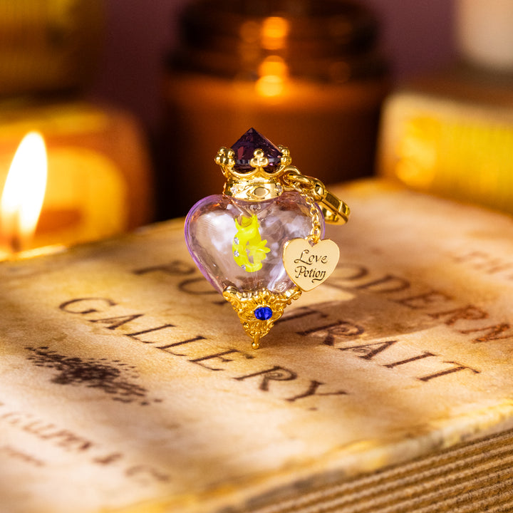 Selenichast Purple Love Potion Bottle Charm Styled with Candles and Book