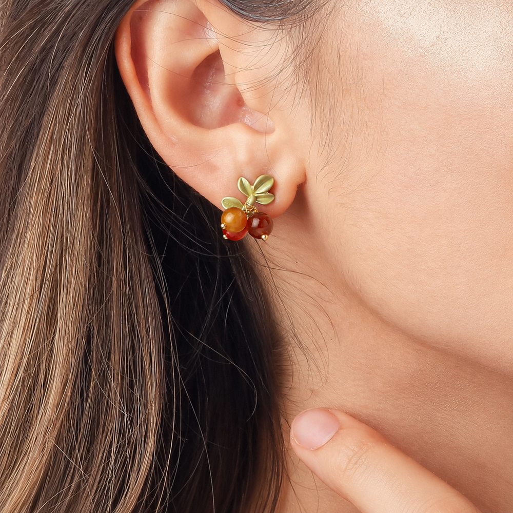 Selenichast Berry Stud Earrings Worn on Ear with Warm Botanical Colors