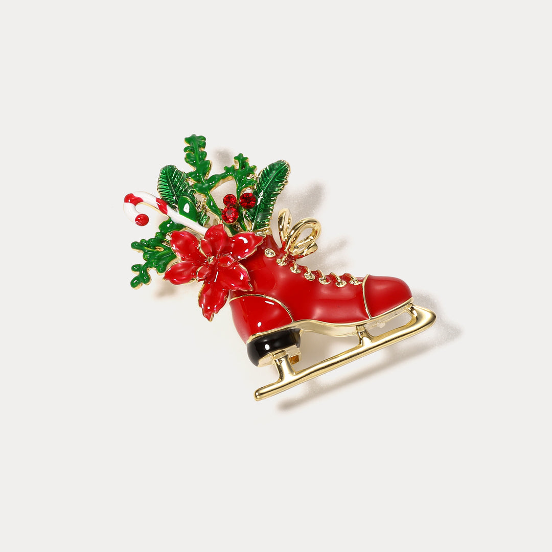 Broche de patinaje navideño