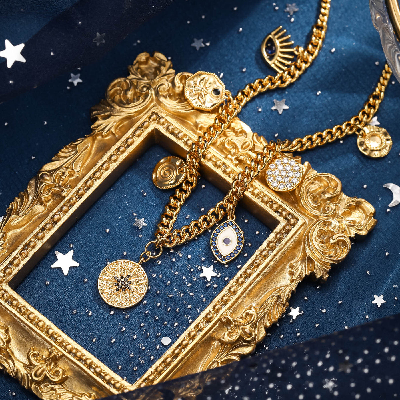 Selenichast Evil Eye Diamond Necklace styled on dark blue celestial fabric with a gold frame